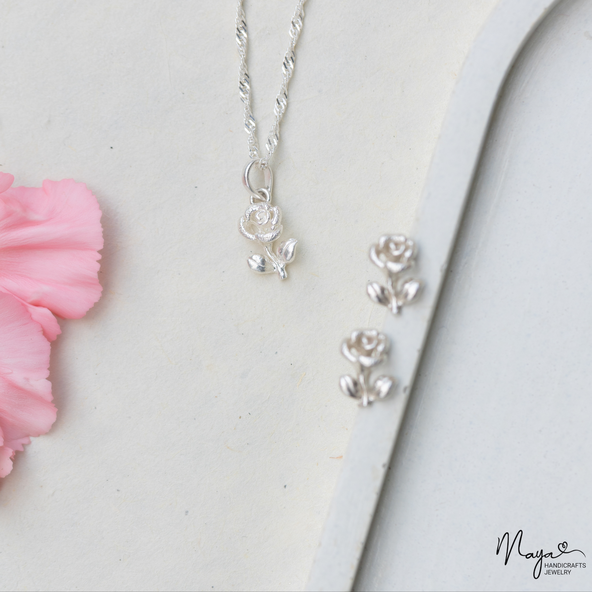 Rose with leaf pendant